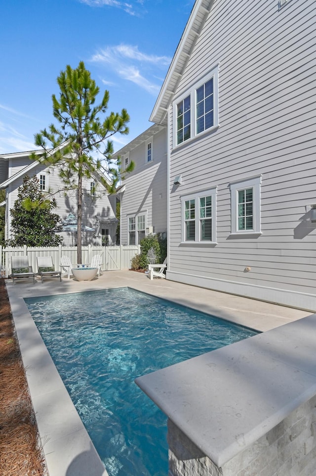 view of swimming pool with a patio