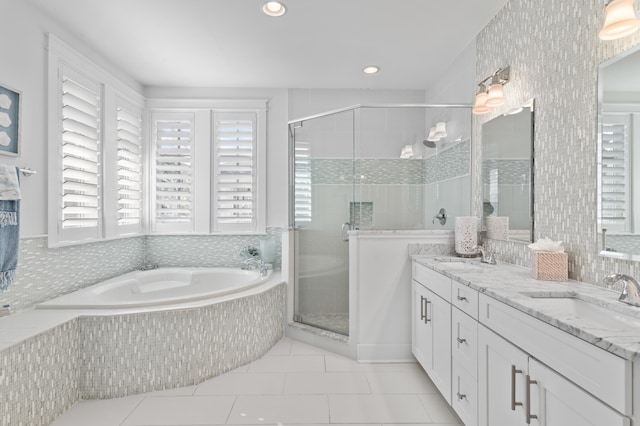 bathroom with vanity, tile patterned flooring, and independent shower and bath