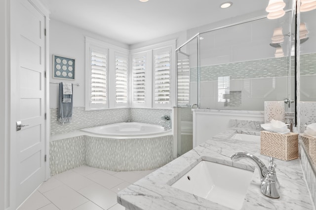 bathroom with vanity, plus walk in shower, and tile patterned flooring