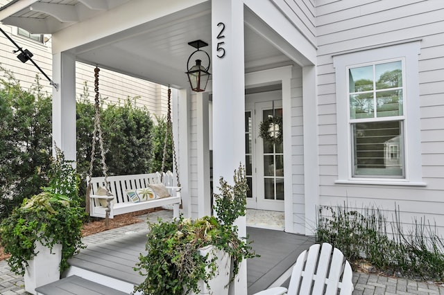 doorway to property featuring covered porch