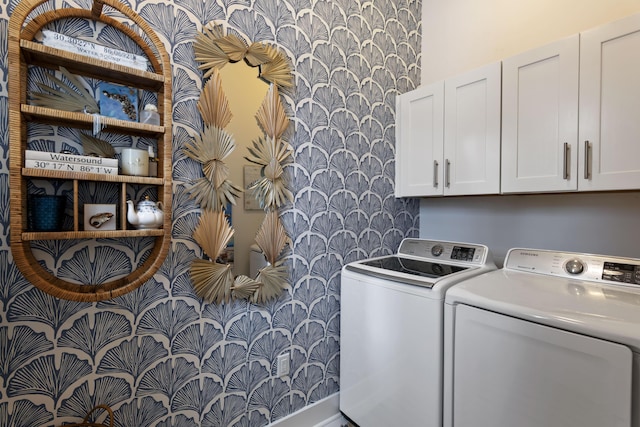 laundry room featuring independent washer and dryer and cabinets