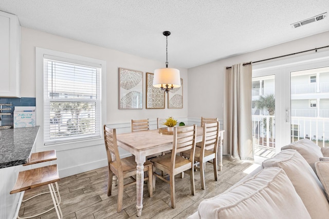 dining area with a textured ceiling