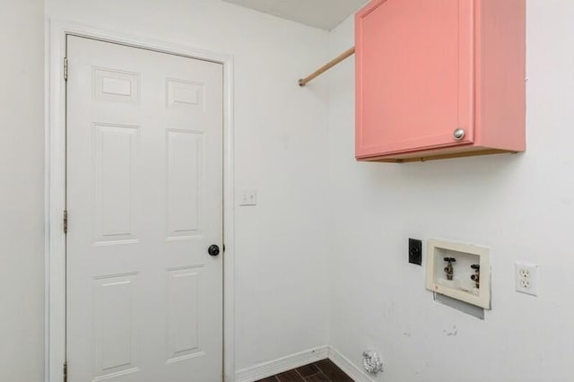 washroom with cabinets, hookup for a washing machine, dark hardwood / wood-style floors, and hookup for an electric dryer