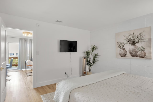 bedroom with light hardwood / wood-style floors