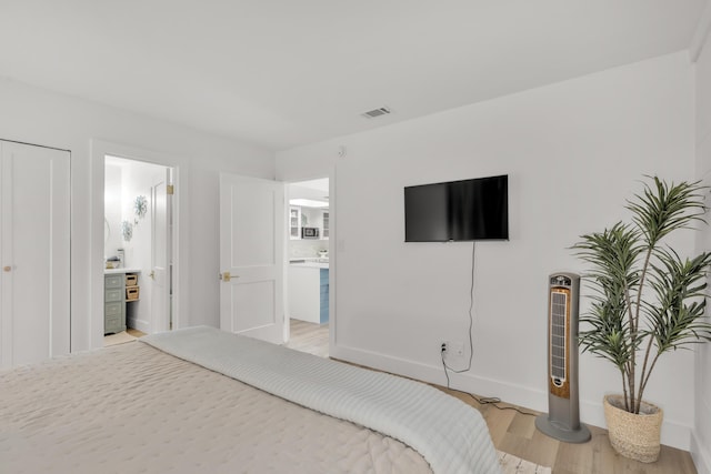 bedroom with light wood-type flooring