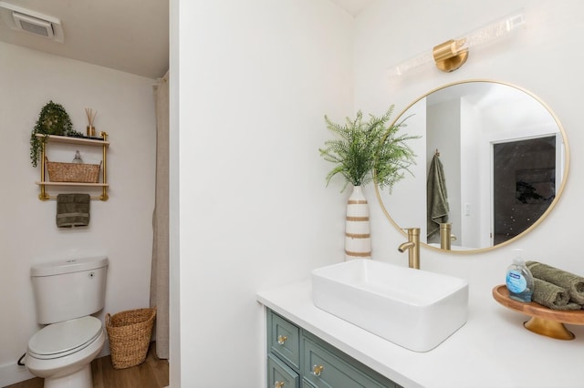 bathroom with vanity and toilet