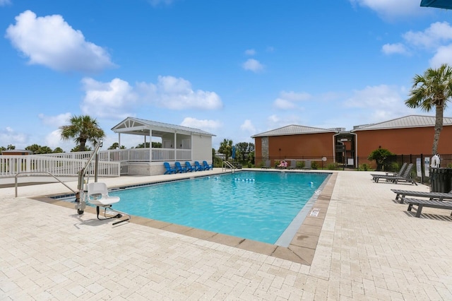 view of swimming pool with a patio area