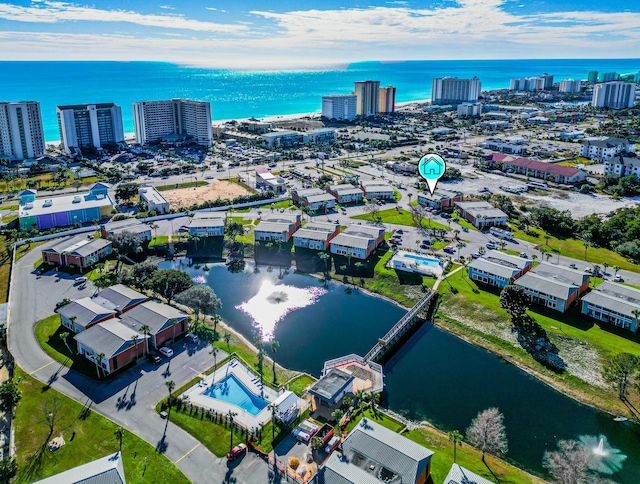 birds eye view of property with a water view