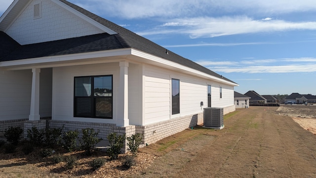 view of side of home with cooling unit