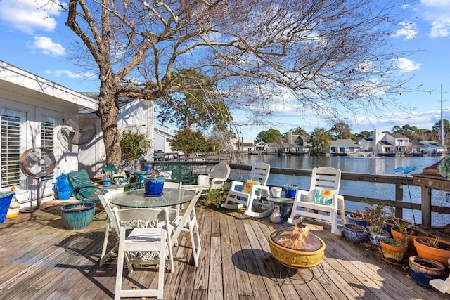 wooden deck featuring a water view