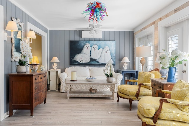 living area with light hardwood / wood-style flooring and ceiling fan