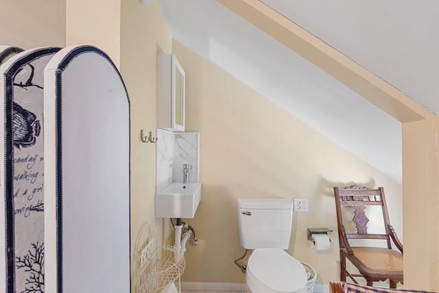 bathroom featuring toilet and sink