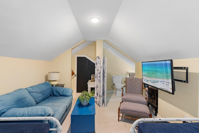 bedroom featuring vaulted ceiling and carpet flooring