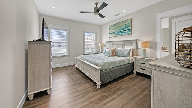 bedroom with dark hardwood / wood-style floors and ceiling fan