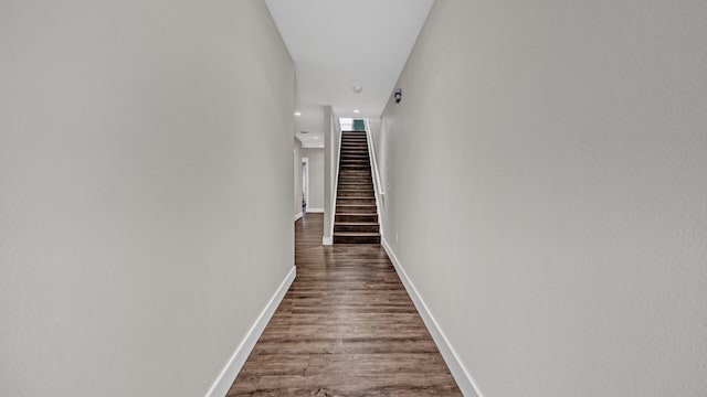 corridor featuring hardwood / wood-style floors