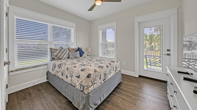 bedroom with ceiling fan, dark hardwood / wood-style floors, and access to outside