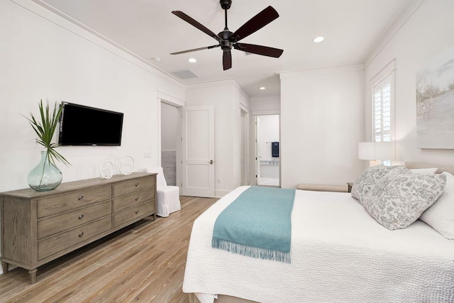 bedroom featuring ornamental molding, light hardwood / wood-style floors, and ceiling fan