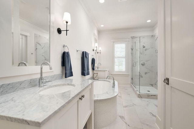 bathroom featuring vanity, a shower with shower door, and ornamental molding