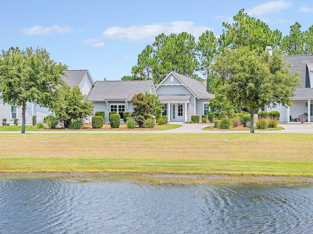 view of front of property featuring a water view and a front yard