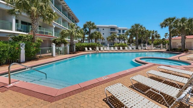 view of pool featuring a hot tub