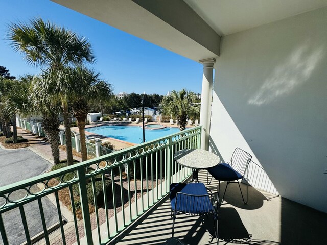 balcony with an in ground hot tub