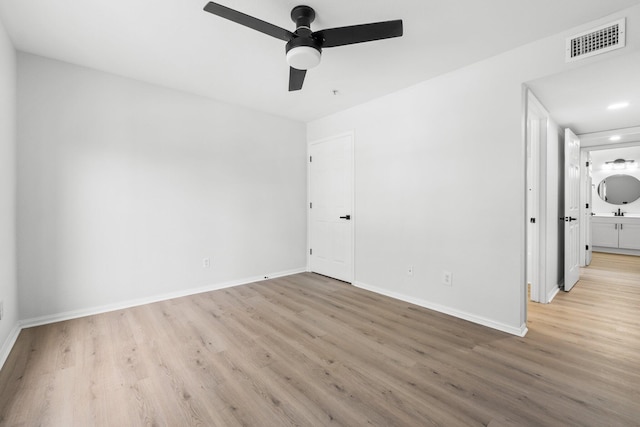 unfurnished room with light hardwood / wood-style flooring and ceiling fan