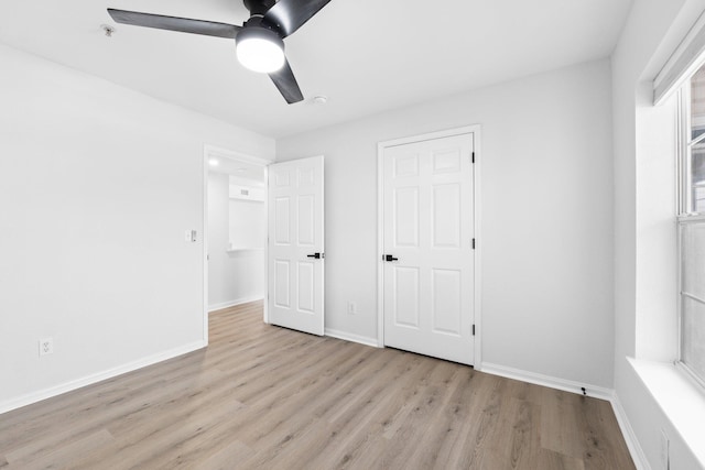 unfurnished bedroom featuring ceiling fan and light hardwood / wood-style floors