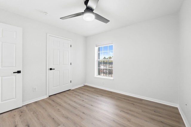 spare room featuring ceiling fan and light hardwood / wood-style floors