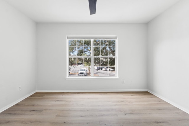 unfurnished room with light hardwood / wood-style floors