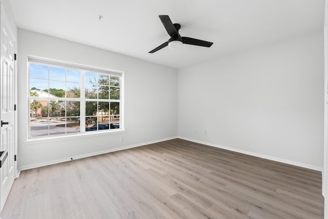 unfurnished room featuring ceiling fan and light wood-type flooring