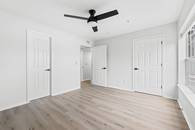 unfurnished bedroom with light hardwood / wood-style flooring and ceiling fan