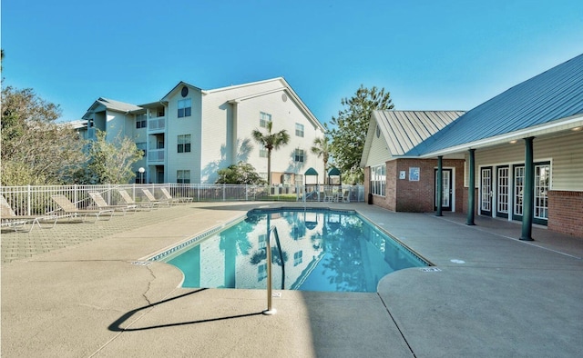 view of swimming pool featuring a patio area