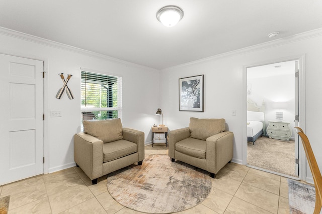 sitting room featuring crown molding and light tile patterned flooring