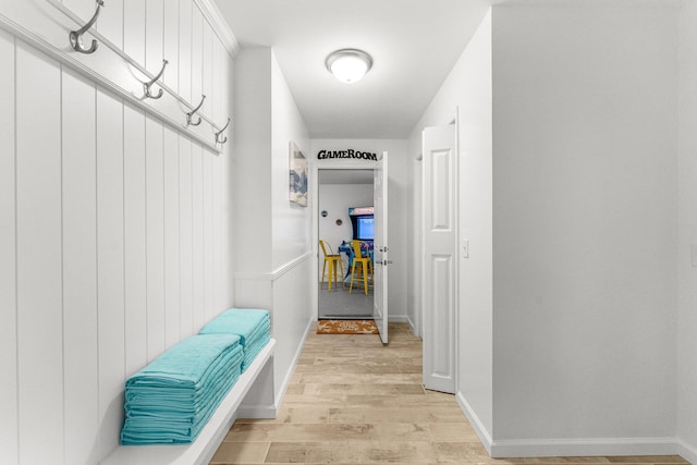 mudroom with light hardwood / wood-style floors