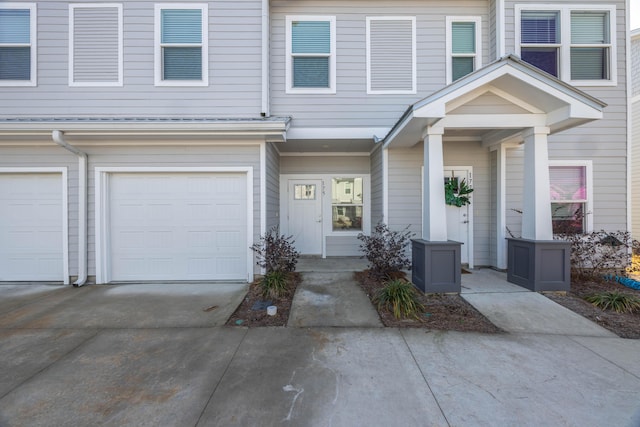 multi unit property featuring a garage