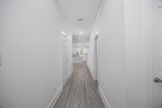 corridor featuring light hardwood / wood-style flooring