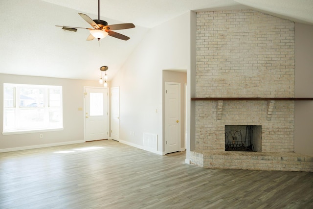 unfurnished living room with ceiling fan, a fireplace, high vaulted ceiling, and wood-type flooring