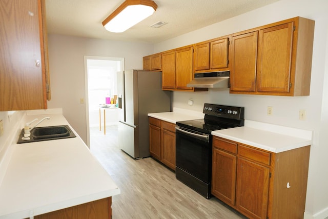 kitchen featuring stainless steel fridge with ice dispenser, black / electric stove, sink, and light wood-type flooring