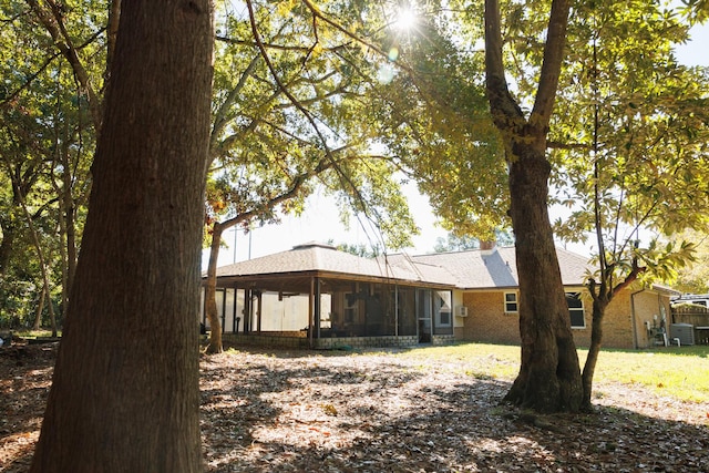 back of house with a sunroom