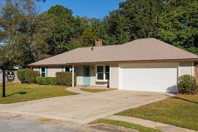 single story home with a garage and a front yard