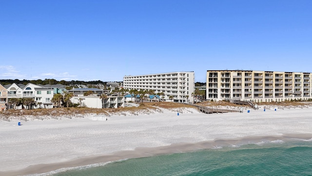 bird's eye view with a water view and a view of the beach