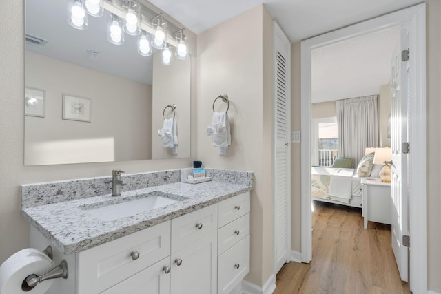 bathroom featuring vanity and hardwood / wood-style floors