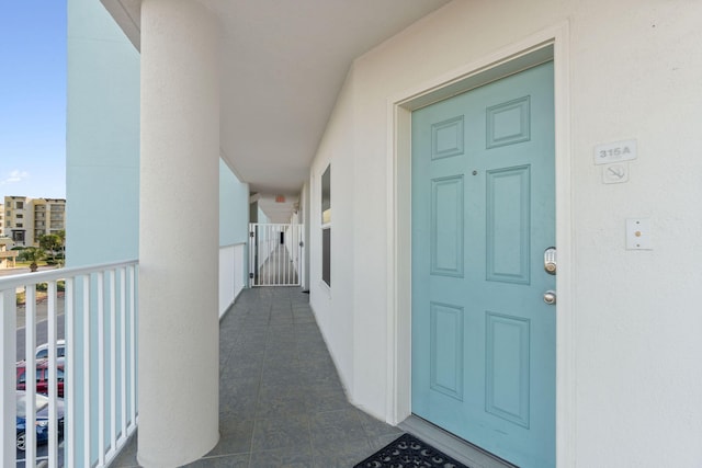 doorway to property featuring a balcony