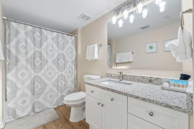 bathroom with vanity, hardwood / wood-style floors, toilet, and a shower with shower curtain