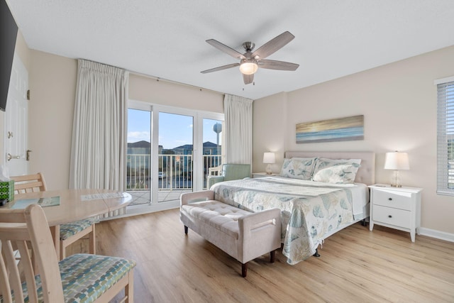 bedroom with access to outside, ceiling fan, and light hardwood / wood-style flooring