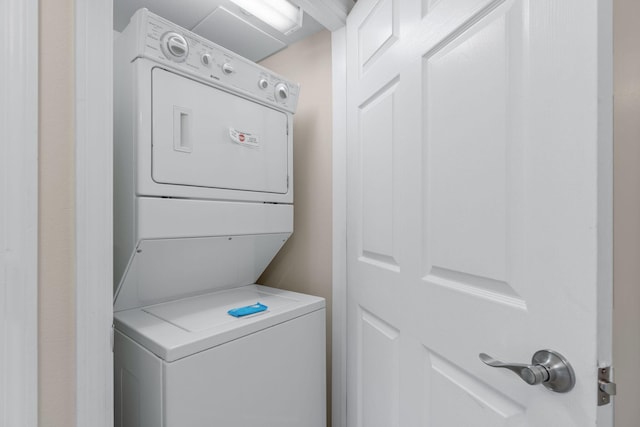 laundry room featuring stacked washer / dryer