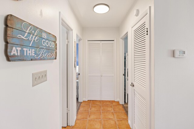 hallway featuring light tile patterned flooring