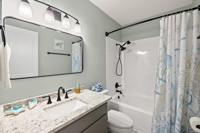 full bathroom with shower / tub combo with curtain, vanity, and toilet