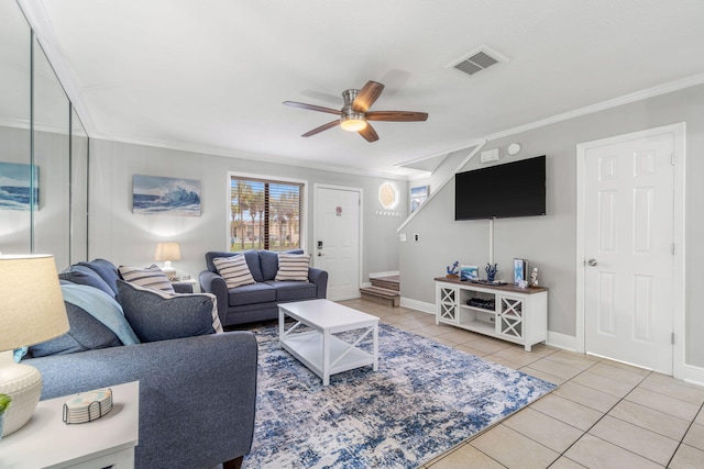 tiled living room with crown molding and ceiling fan