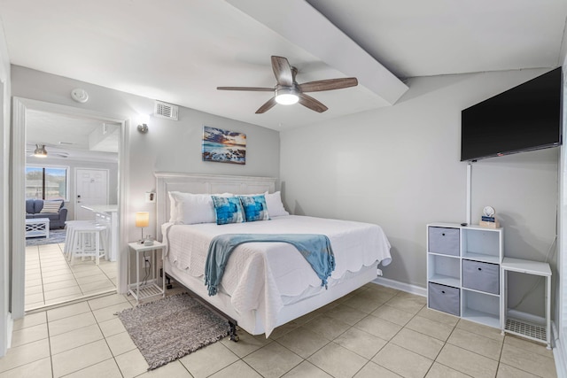 bedroom with ceiling fan and light tile patterned flooring